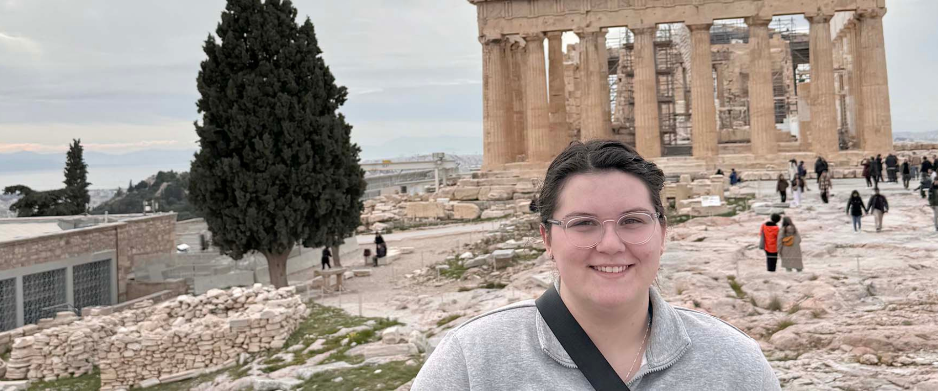 student poses for a photo abroad