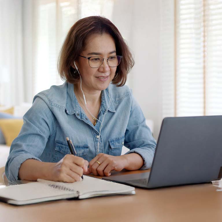 Adult online student with laptop